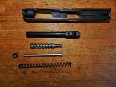 Gen3 performance parts next to the captured dual spring factory guide rod.